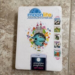 Moonlite Storybook Projector Set. Attached to your phone. New in box. Children’s